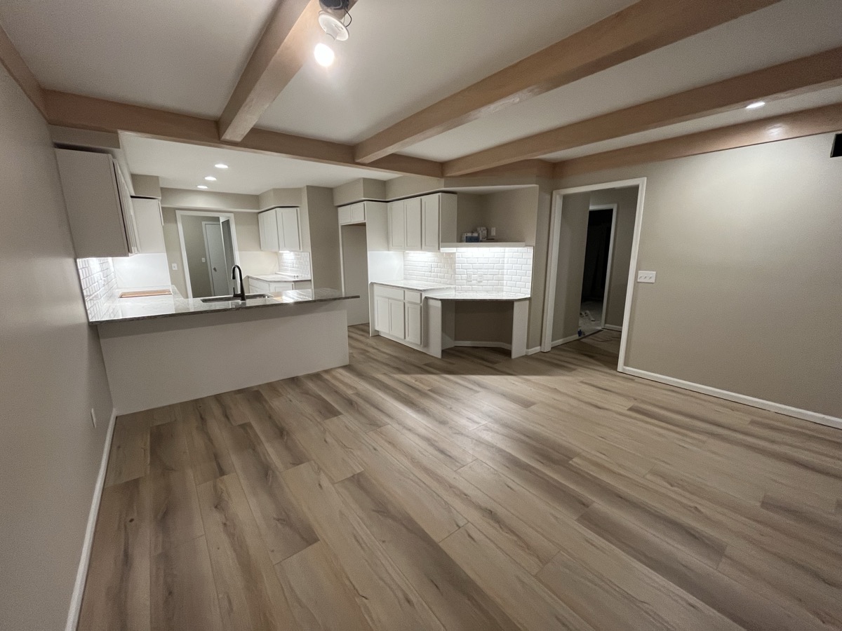LVP kitchen with exposed ceiling beams